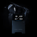 Golfer using a launch monitor with digital display on a black background