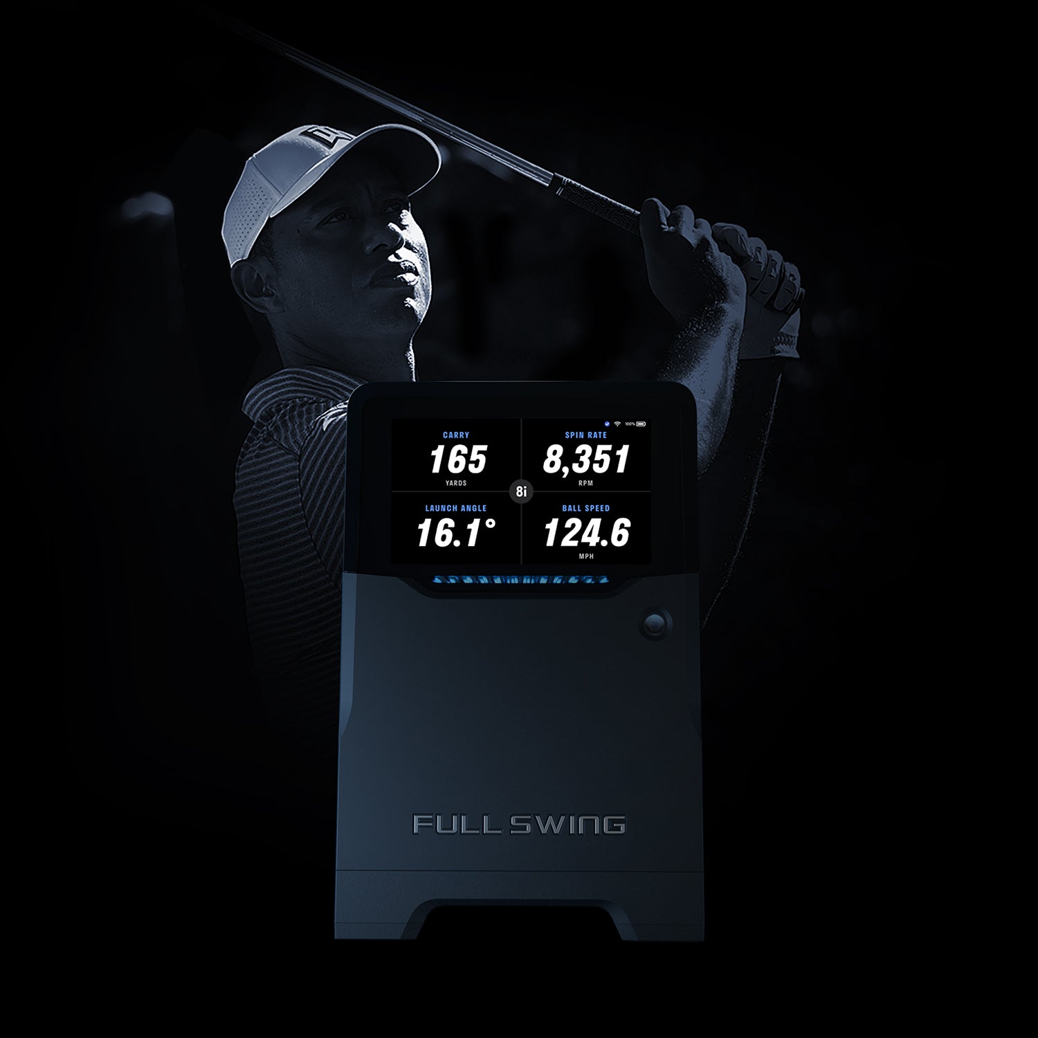 Golfer using a launch monitor with digital display on a black background