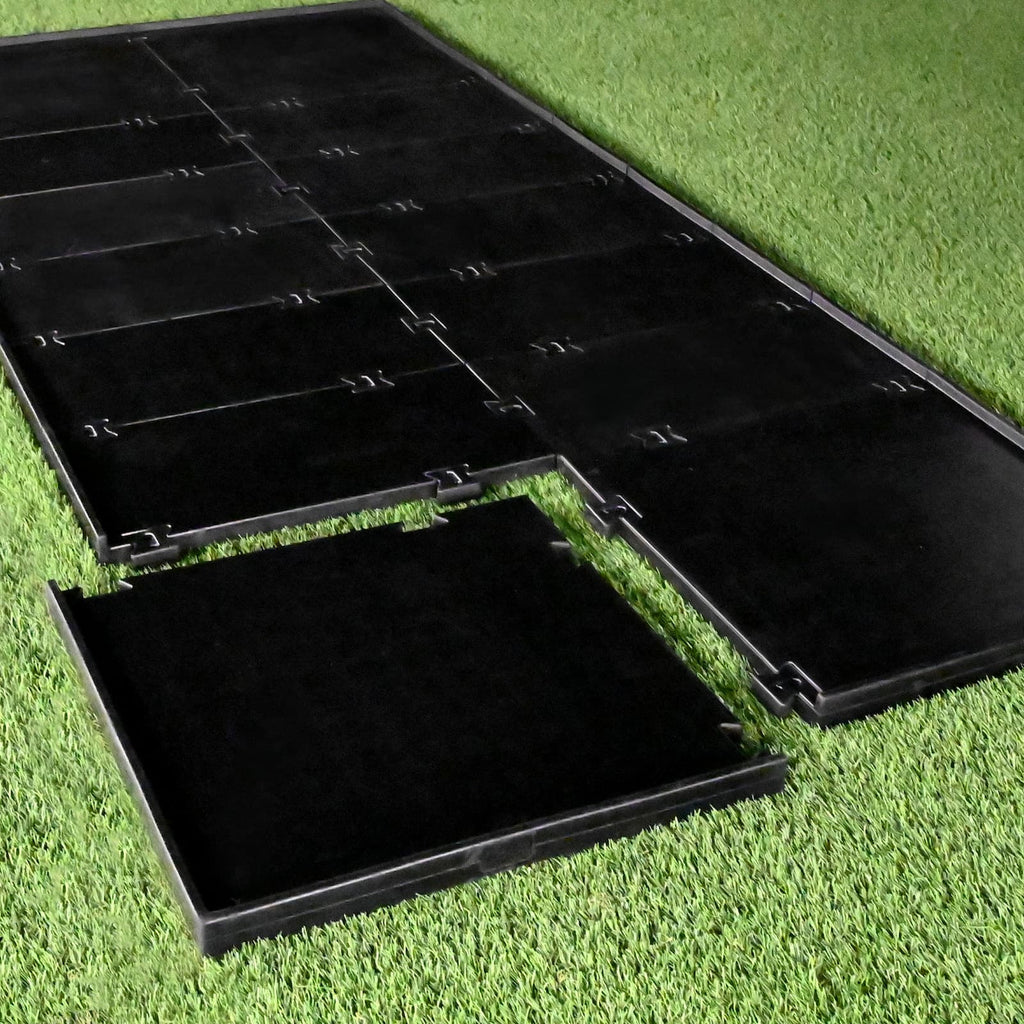 Black plastic mats on grass