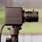 Close-up of a security camera on a blurred background