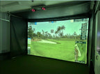 Indoor golf simulator with a screen displaying a golf course