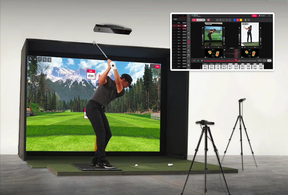 Golf simulator setup with screen displaying a golfer on a virtual course, surrounded by technical equipment.