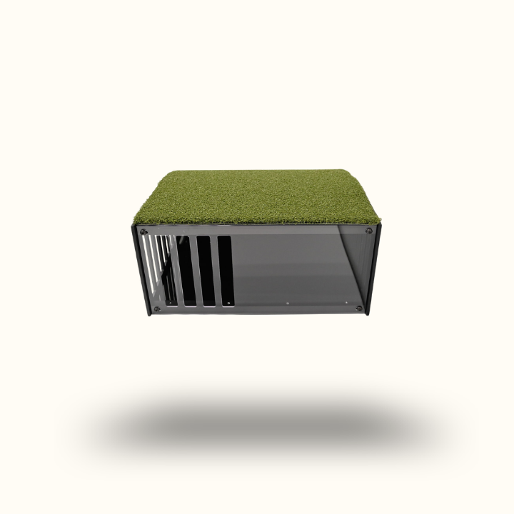 Pet crate with green top on a white background