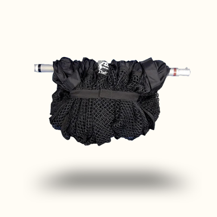 Black fishing net with a white handle on a white background