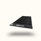 Black mat with 'UNEEEKOR' branding on a white background