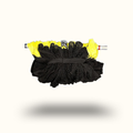 Black cleaning brush with yellow bristles on a white background