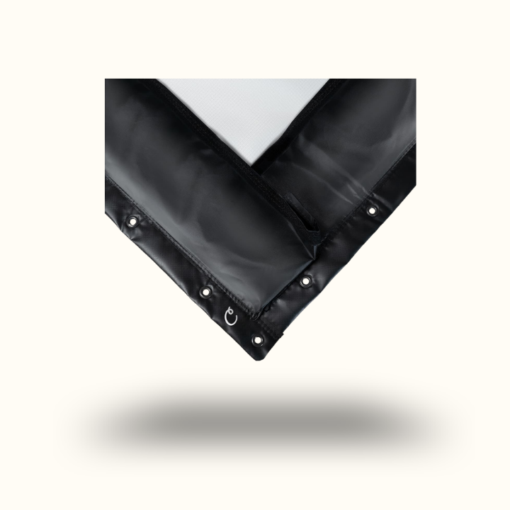 Black plastic sheet with grommets on a white background