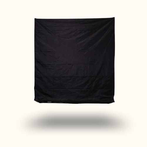 Black fabric draped over a white background