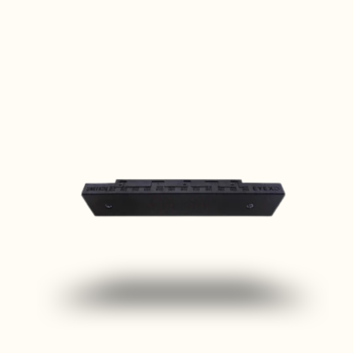 Black rectangular object with multiple slots on a white background