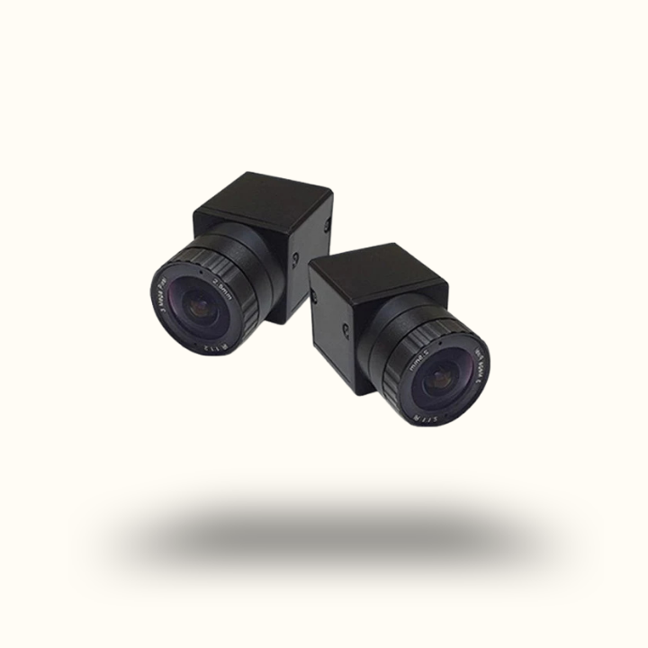 Two black surveillance cameras on a white background
