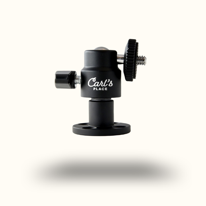 Black camera mount with 'Carl's Place' branding on a white background