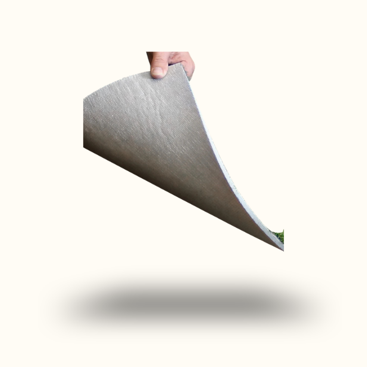 Hand holding a piece of gray fabric against a white background