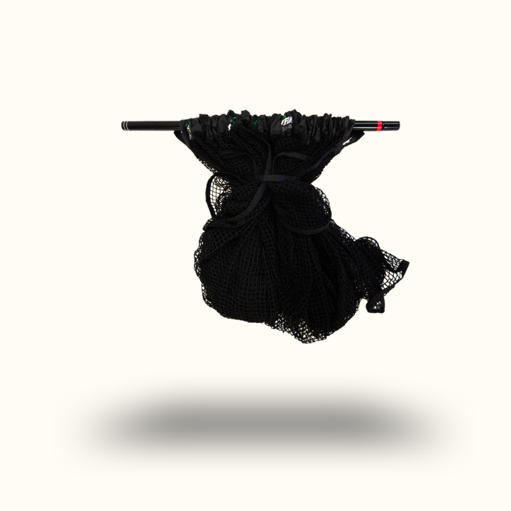 Black mesh bag with a handle on a white background