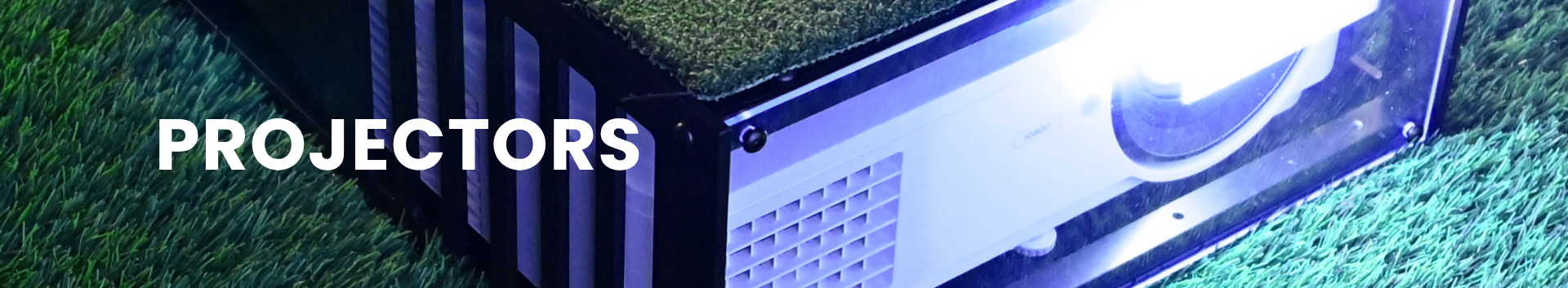 Projector on grass with 'PROJECTORS' text
