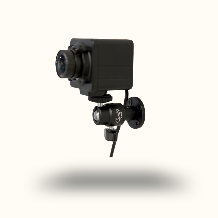 Black security camera on a white background