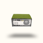 Small electronic device with grass-like top on a white background
