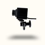 Black camera lens with attached microphone on a white background