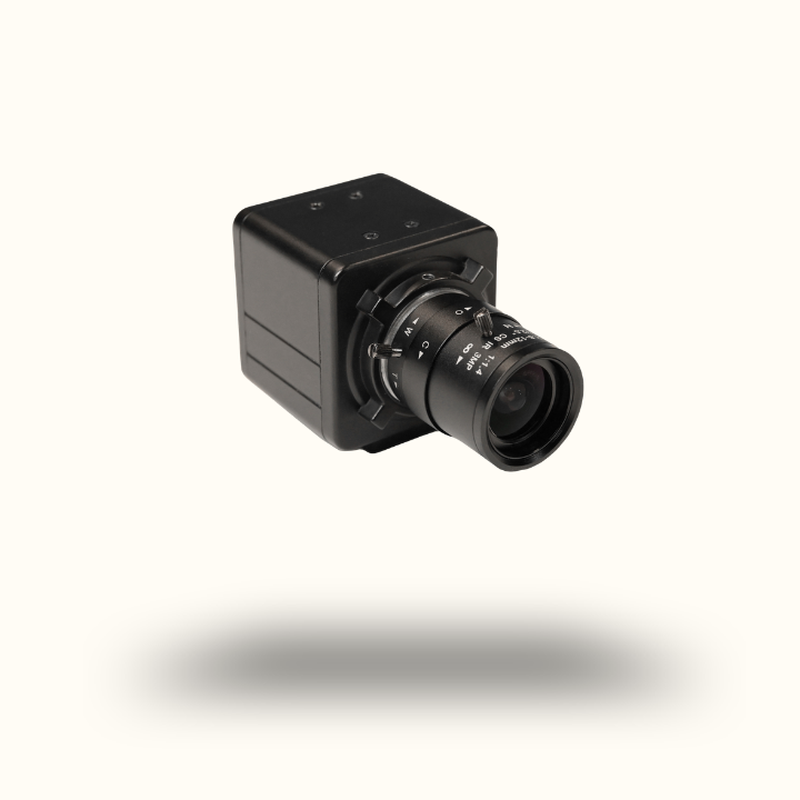 Black surveillance camera on a white background