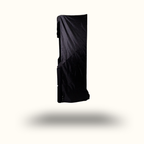 Black rectangular object with a textured surface on a white background