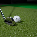 Golf club and ball on a green surface with 'Cart's Place' branding.
